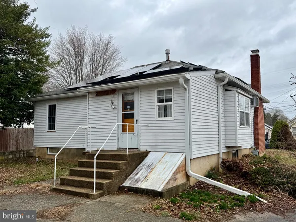a side view of a house with a yard