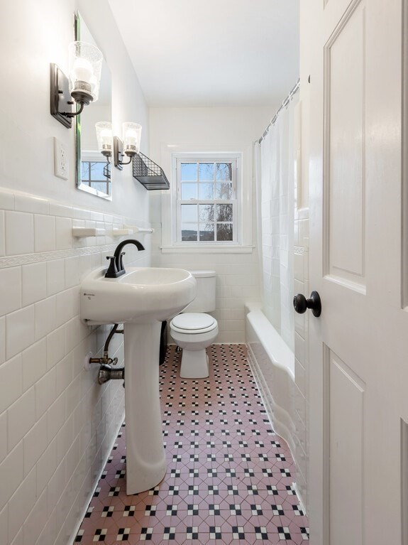 63 Upland Street Worcester, MA 01607 - Photo 17 of 36 a bathroom with a sink toilet and shower