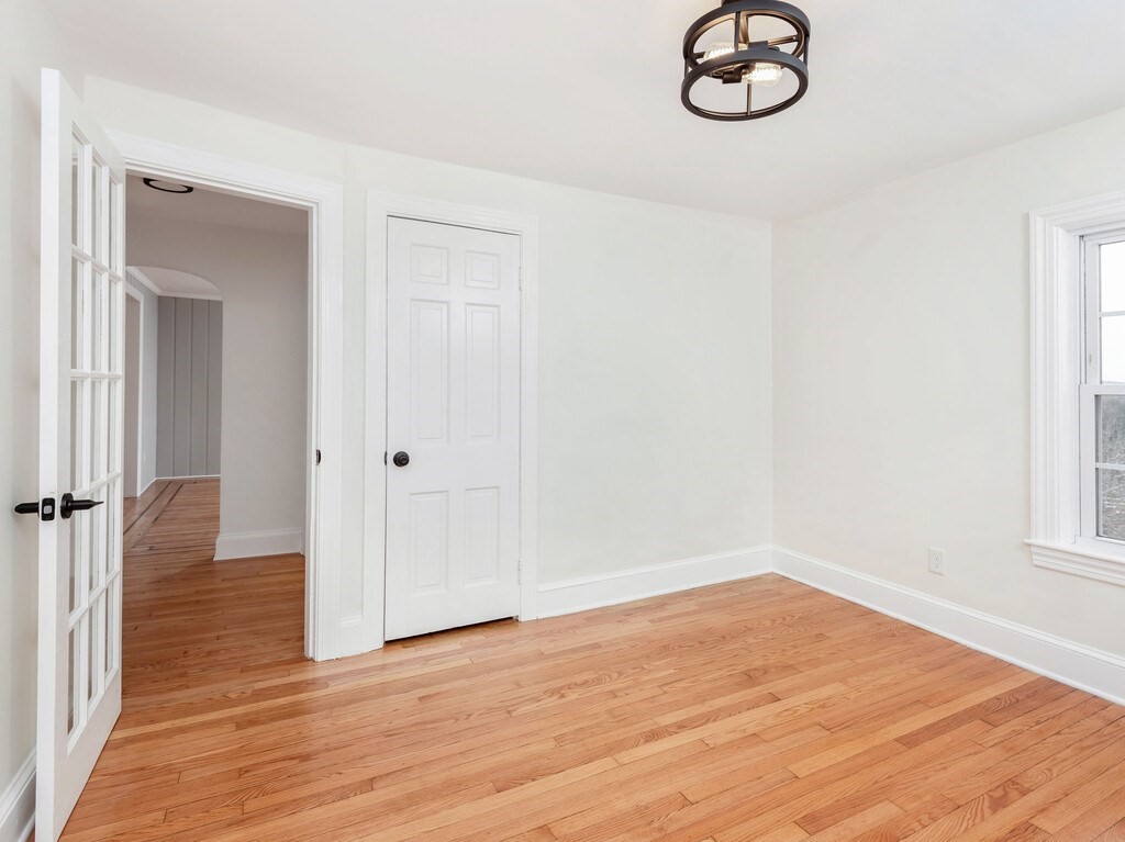 63 Upland Street Worcester, MA 01607 - Photo 18 of 36 a view of a room with wooden floor and window