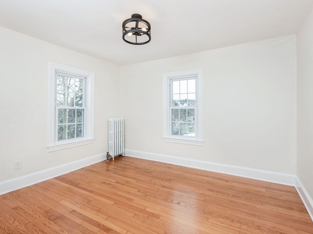 63 Upland Street Worcester, MA 01607 - Photo 19 of 36 an empty room with a window