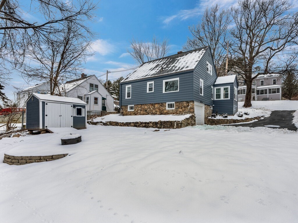 63 Upland Street Worcester, MA 01607 - Photo 31 of 36 a view of a house with a snow in front of it