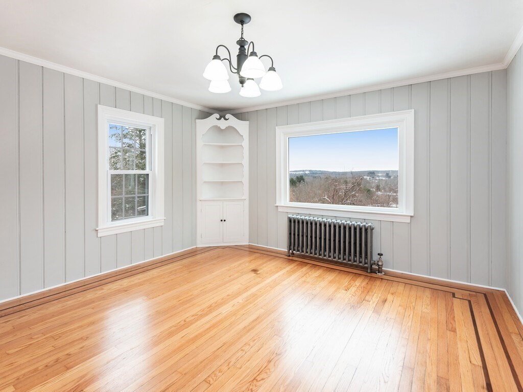 63 Upland Street Worcester, MA 01607 - Photo 10 of 36 a view of an empty room with a window