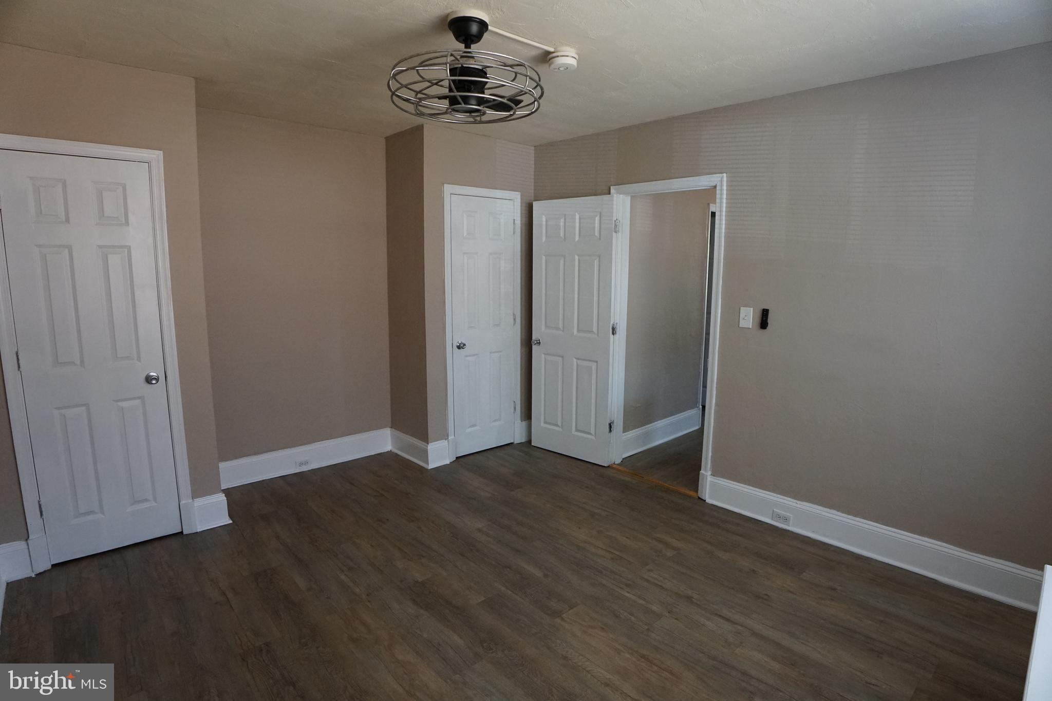 2 Aigburth Road, Unit 1 Towson, MD 21286 - Photo 9 of 10 a view of an empty room with a chandelier