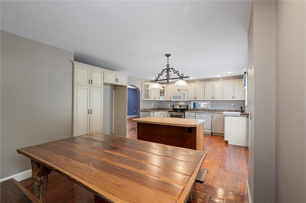 623 Marco Road Apollo, PA 15613 - Photo 13 of 36 a kitchen with kitchen island stainless steel appliances a sink stove and refrigerator