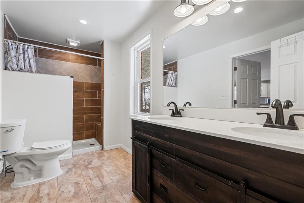 623 Marco Road Apollo, PA 15613 - Photo 15 of 36 a bathroom with a double vanity sink mirror and toilet