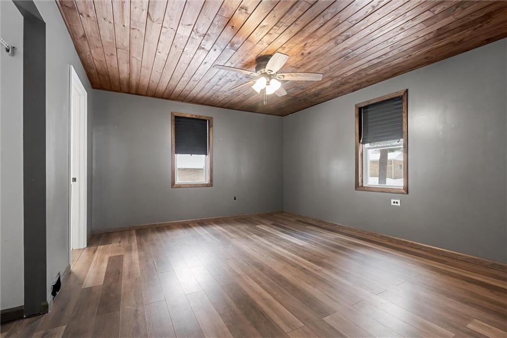 623 Marco Road Apollo, PA 15613 - Photo 18 of 36 an empty room with wooden floor chandelier fan and windows