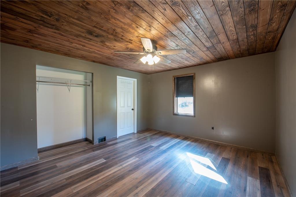623 Marco Road Apollo, PA 15613 - Photo 18 of 42 a view of an empty room with window and wooden floor
