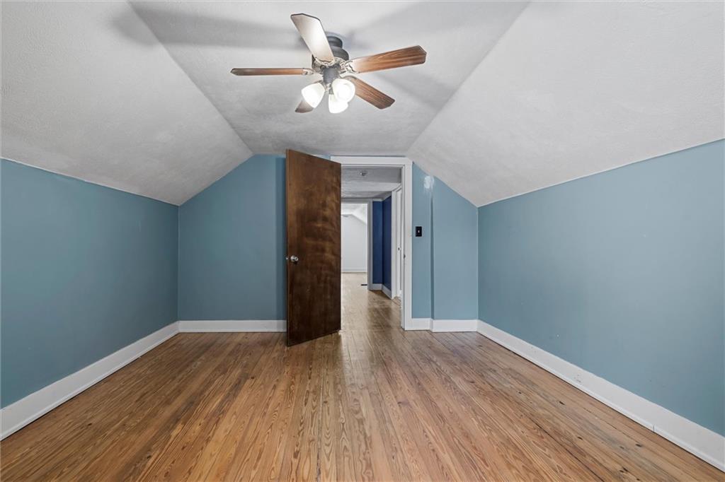 623 Marco Road Apollo, PA 15613 - Photo 20 of 36 a view of a big room with wooden floor and a ceiling fan