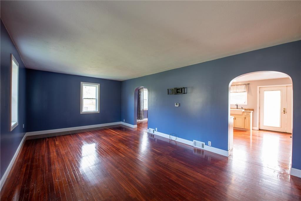 623 Marco Road Apollo, PA 15613 - Photo 2 of 42 an empty room with wooden floor and windows