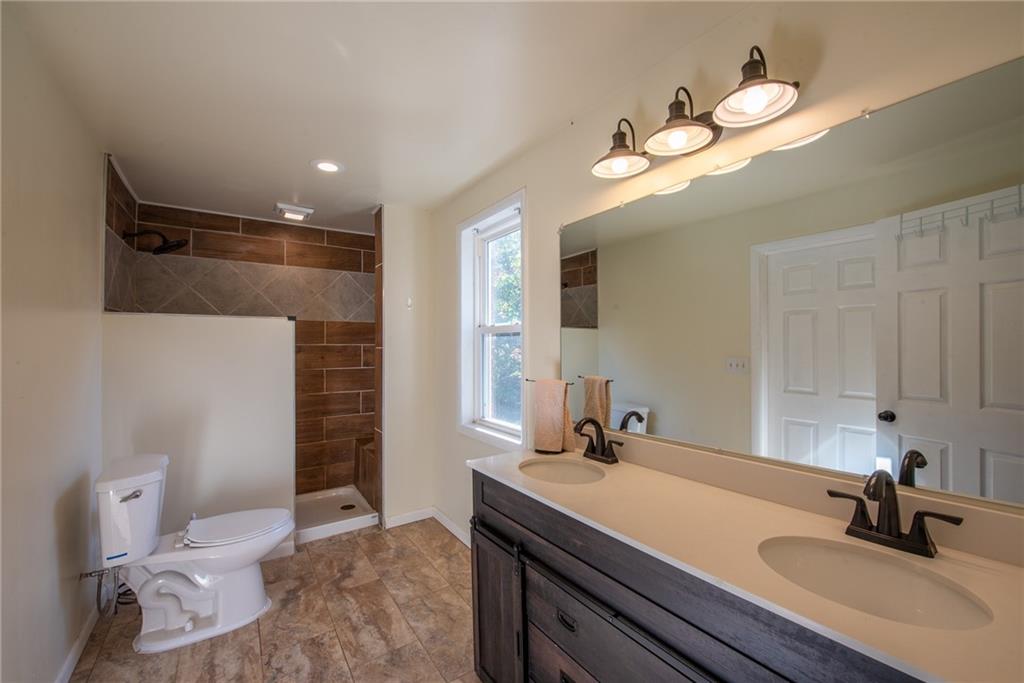 623 Marco Road Apollo, PA 15613 - Photo 21 of 42 a bathroom with a sink a light fixture and a toilet