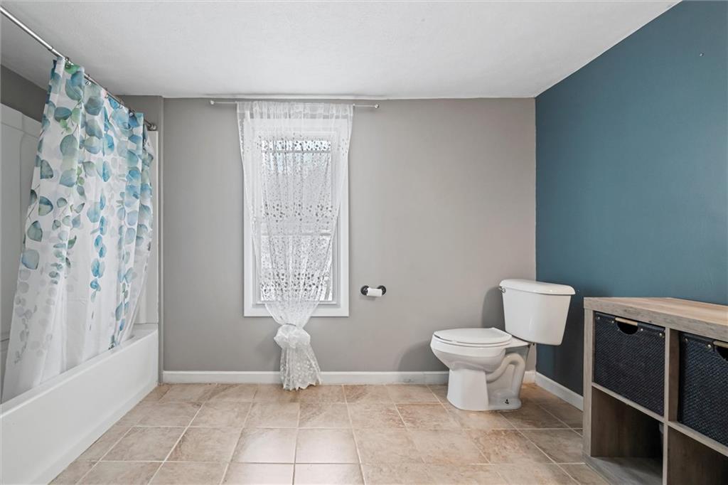 623 Marco Road Apollo, PA 15613 - Photo 22 of 36 a bathroom with a toilet a sink and a window