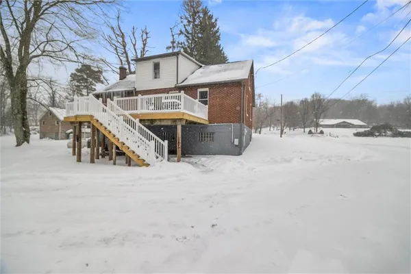 a view of a house with a snow