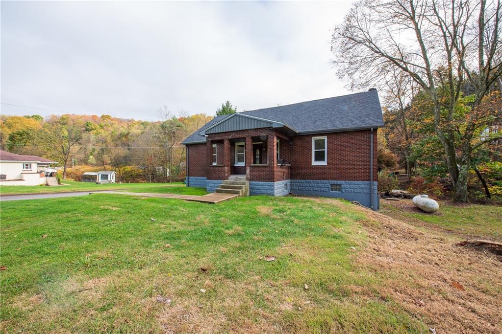 623 Marco Road Apollo, PA 15613 - Photo 39 of 42 a front view of a house with a yard