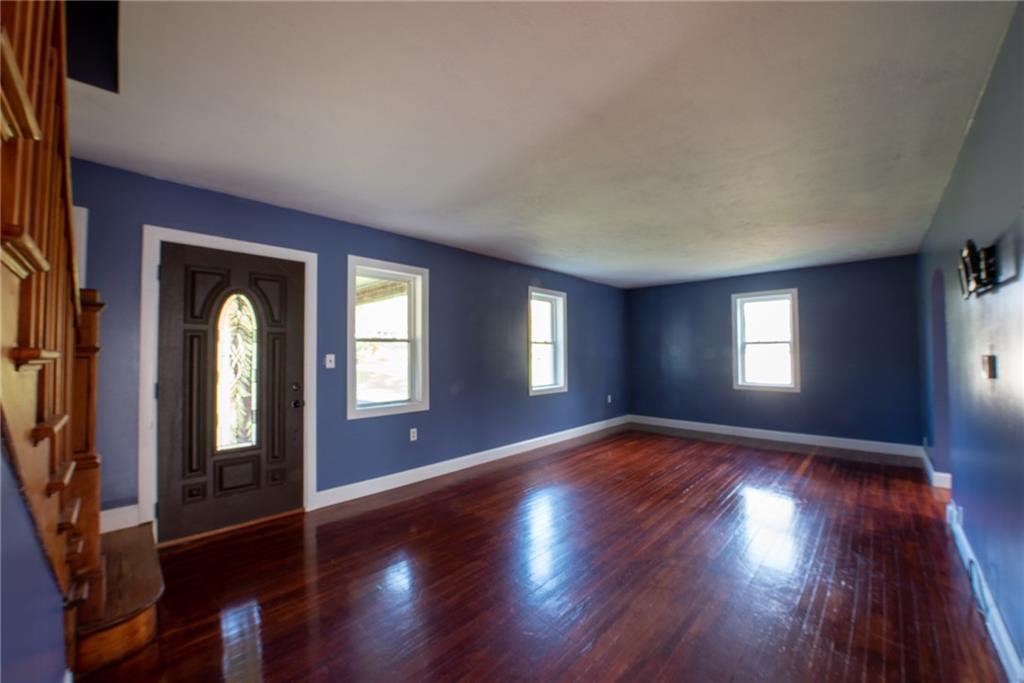 623 Marco Road Apollo, PA 15613 - Photo 5 of 42 an empty room with wooden floor and windows