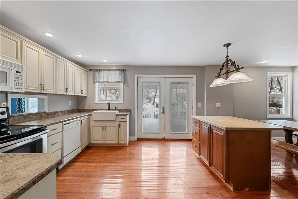 623 Marco Road Apollo, PA 15613 - Photo 6 of 36 a kitchen with granite countertop a stove top oven and cabinets