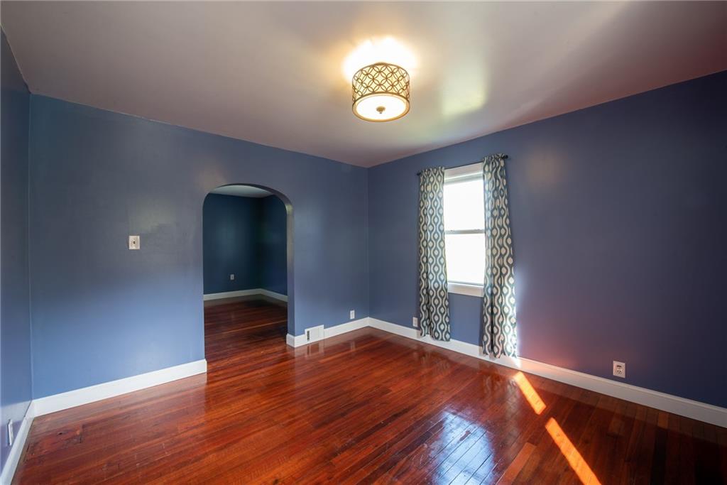 623 Marco Road Apollo, PA 15613 - Photo 8 of 42 a view of an empty room with window and wooden floor