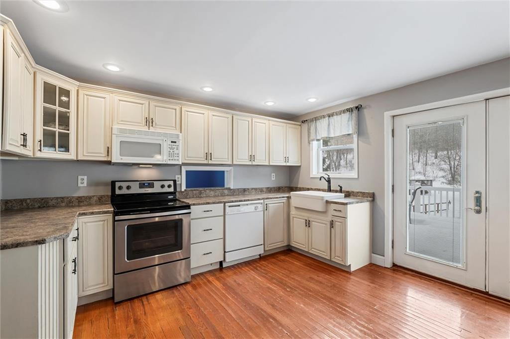 623 Marco Road Apollo, PA 15613 - Photo 9 of 36 a kitchen with a stove a sink and a microwave
