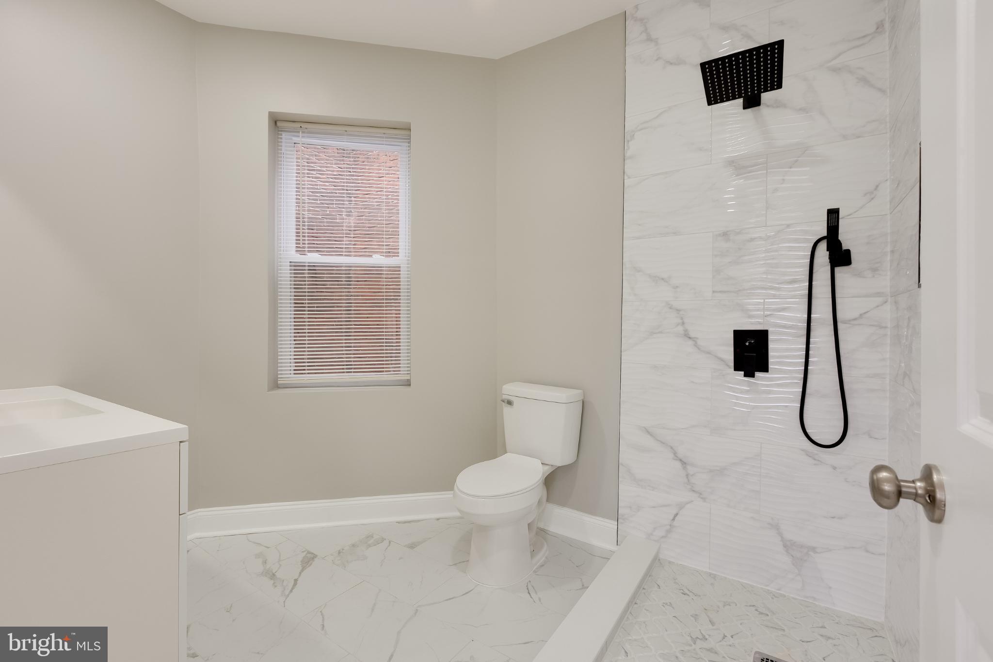 5239 Arch Street Philadelphia, PA 19139 - Photo 15 of 36 Sleek modern bathroom with elegant finishes.