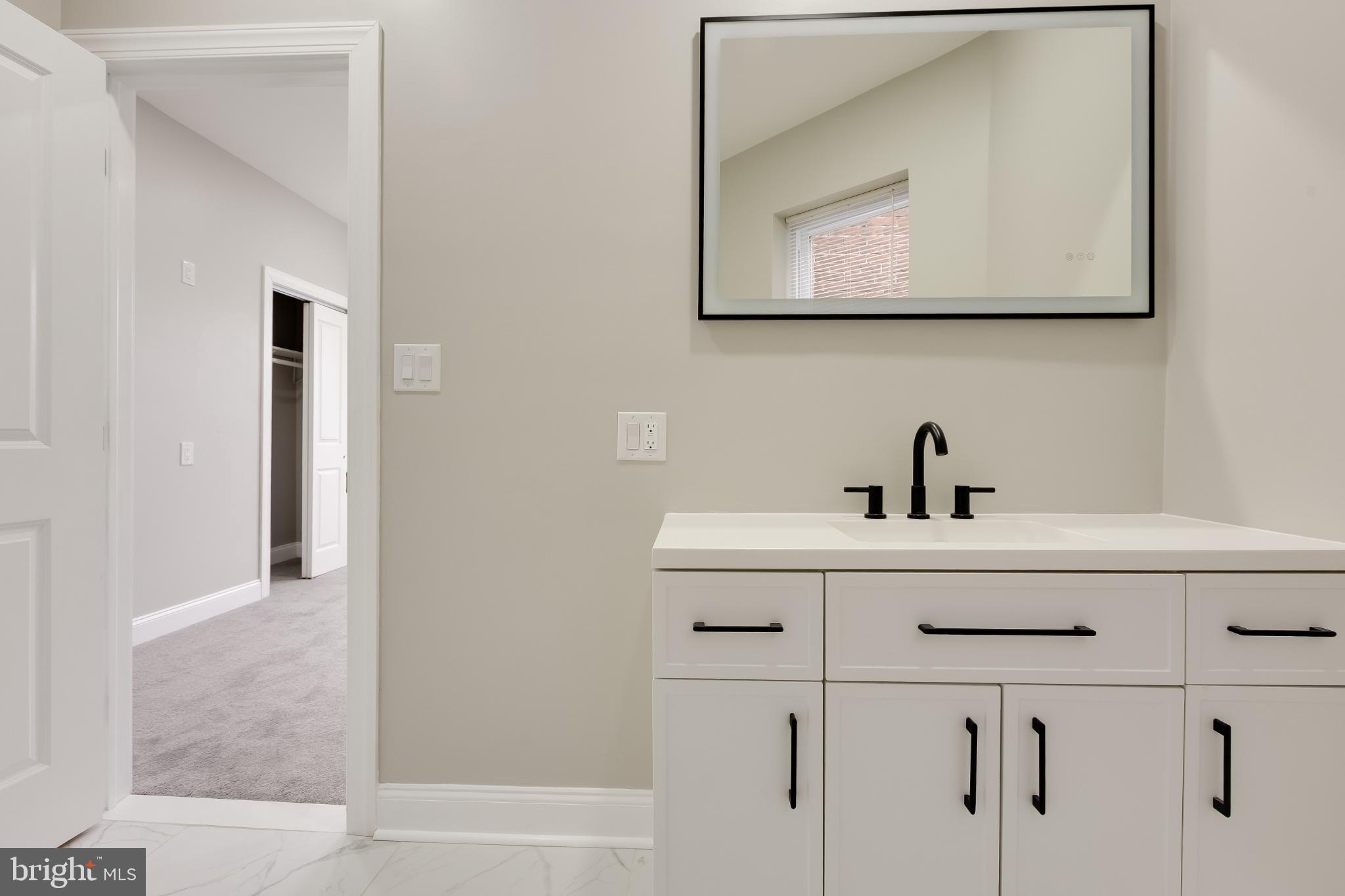 5239 Arch Street Philadelphia, PA 19139 - Photo 24 of 36 Sleek modern bathroom with elegant finishes.