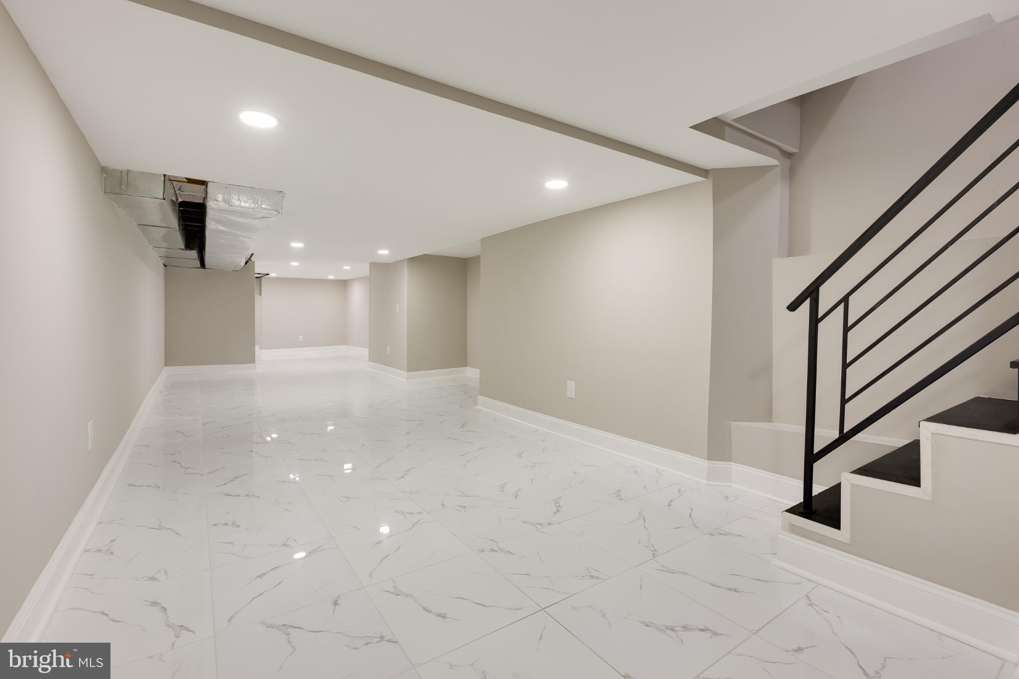 5239 Arch Street Philadelphia, PA 19139 - Photo 29 of 36 Spacious, modern basement with sleek finishes.