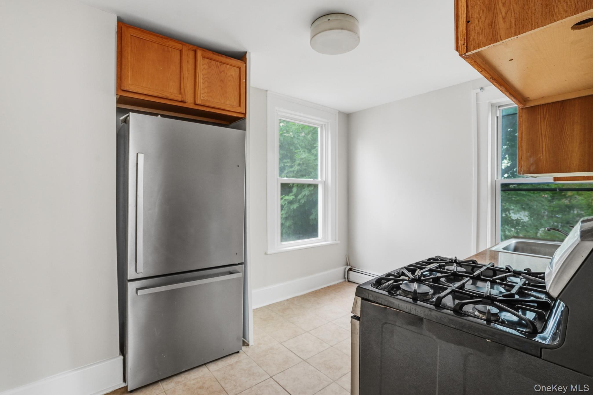 65 North Clinton Street Poughkeepsie, NY 12601 - Photo 22 of 43 a kitchen with stainless steel appliances granite countertop a refrigerator and a sink