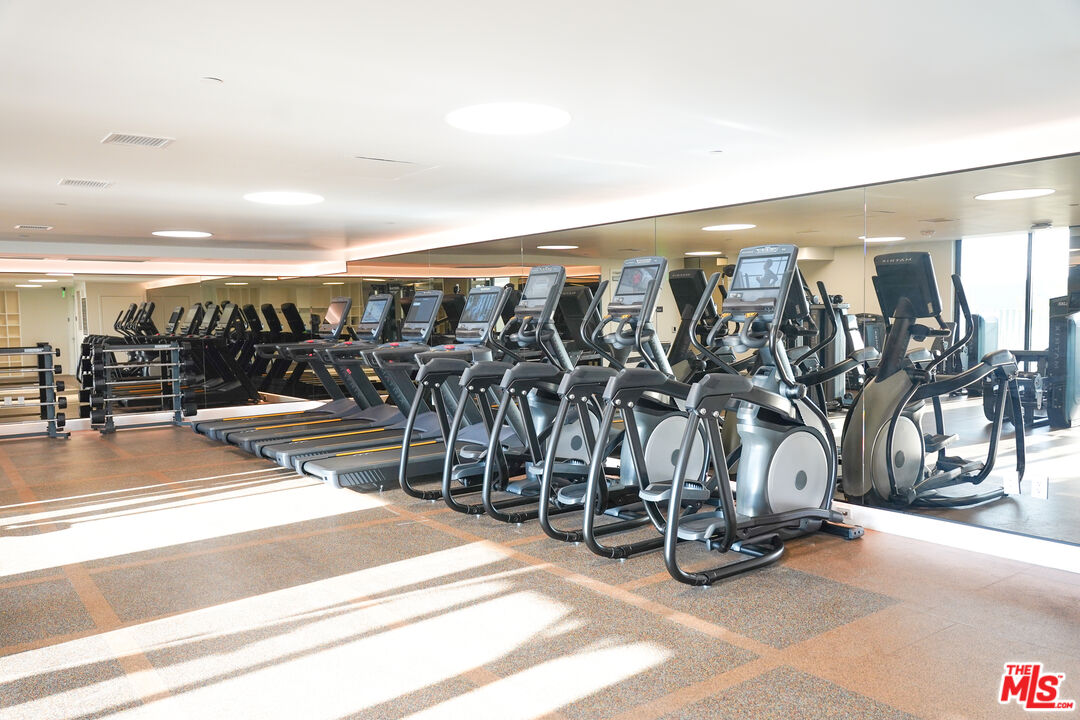 200 Mesnager Street, Unit 618 Los Angeles, CA 90012 - Photo 14 of 24 a view of a room with gym equipment