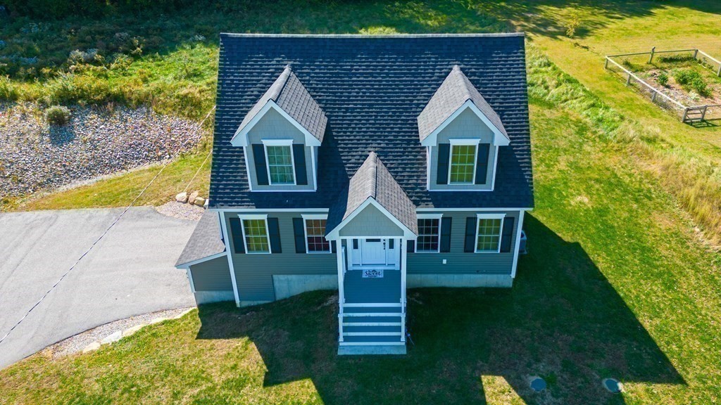 176 Oakham Road Barre, MA 01005 - Photo 11 of 36 a front view of a house with a yard