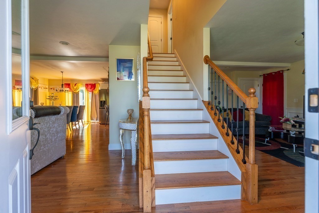 176 Oakham Road Barre, MA 01005 - Photo 14 of 36 a view of entryway and hall with wooden floor