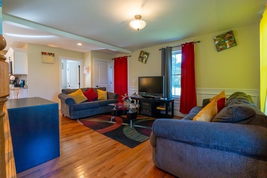 176 Oakham Road Barre, MA 01005 - Photo 17 of 36 a living room with furniture and a flat screen tv