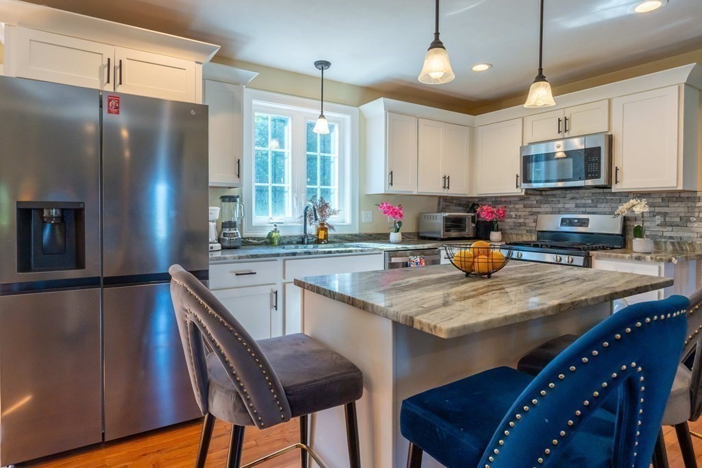 176 Oakham Road Barre, MA 01005 - Photo 21 of 36 a kitchen with stainless steel appliances granite countertop a sink refrigerator and cabinets