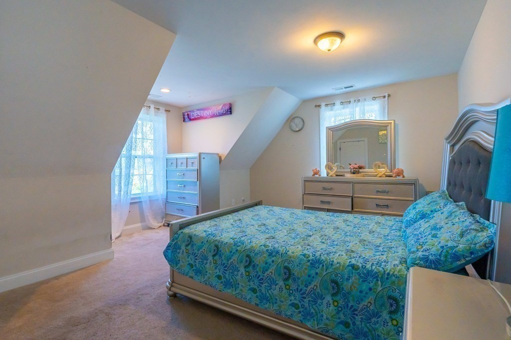 176 Oakham Road Barre, MA 01005 - Photo 30 of 36 a bedroom with a bed and a dresser