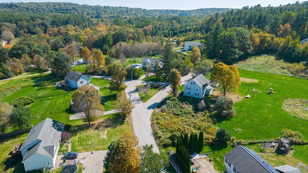 176 Oakham Road Barre, MA 01005 - Photo 3 of 36 an aerial view of residential houses with outdoor space and trees