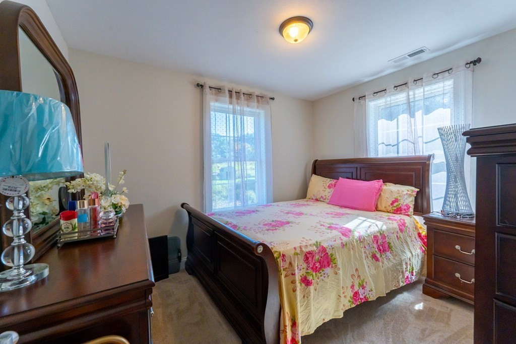176 Oakham Road Barre, MA 01005 - Photo 31 of 36 a bedroom with a bed and a window