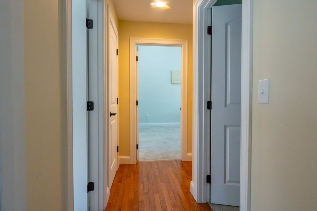176 Oakham Road Barre, MA 01005 - Photo 33 of 36 a view of a hallway with wooden floor