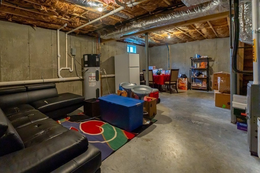 176 Oakham Road Barre, MA 01005 - Photo 34 of 36 a room with lots of furniture and air hockey table