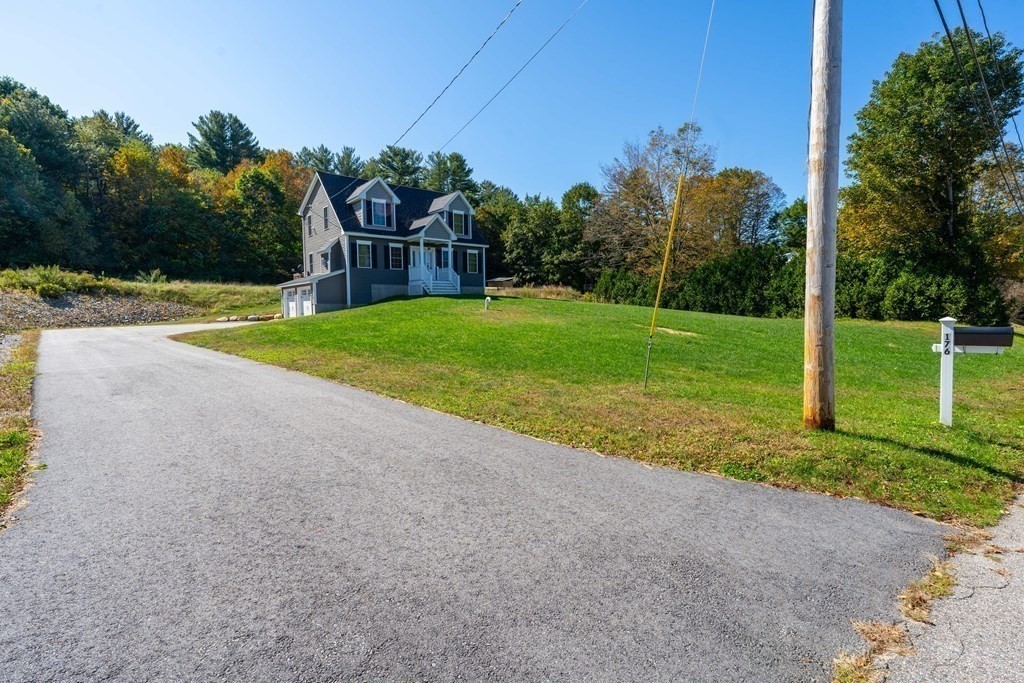 176 Oakham Road Barre, MA 01005 - Photo 5 of 36 a view of a yard with palm trees