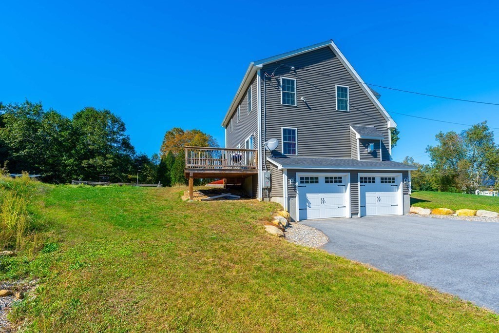 176 Oakham Road Barre, MA 01005 - Photo 7 of 36 a front view of a house with garden