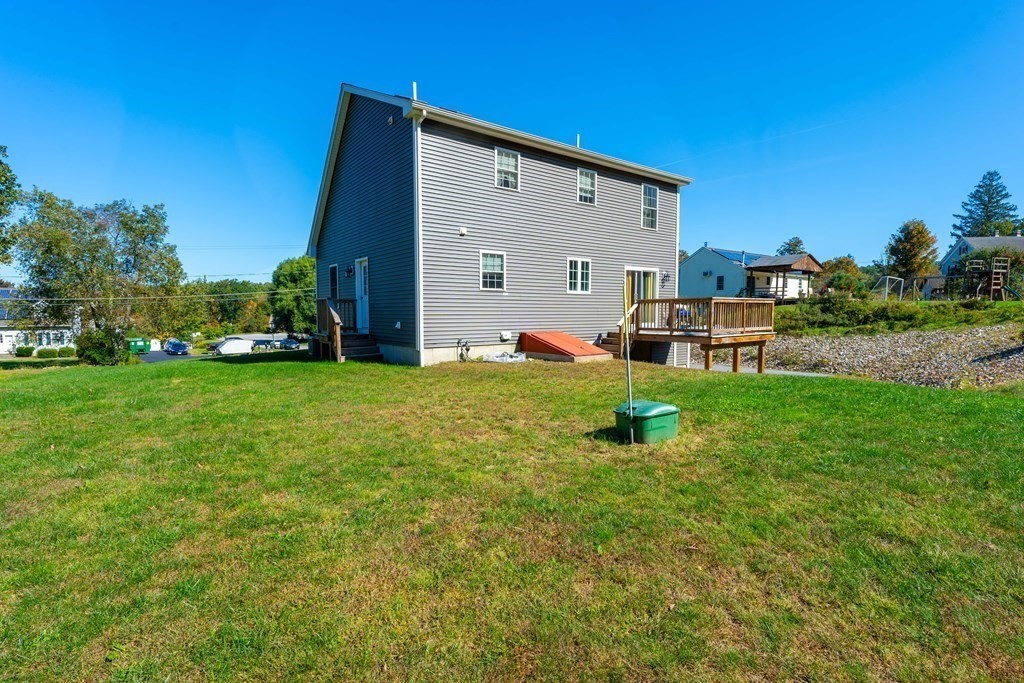 176 Oakham Road Barre, MA 01005 - Photo 8 of 36 a view of a house with backyard sitting area and garden