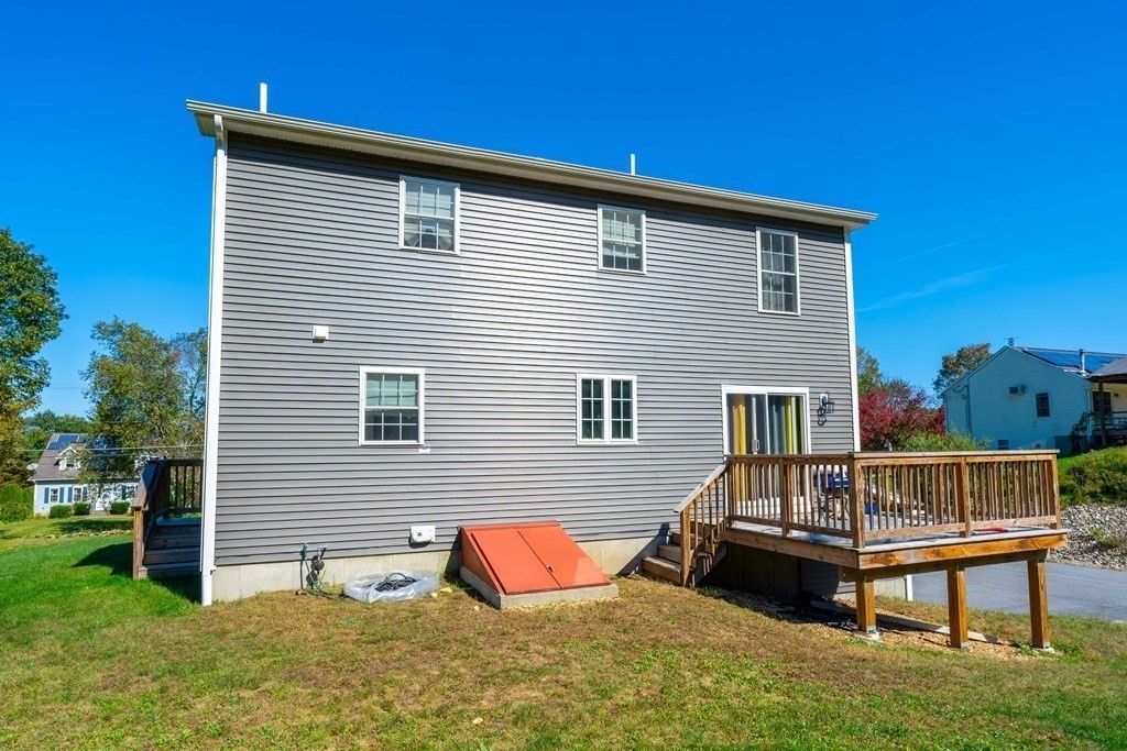 176 Oakham Road Barre, MA 01005 - Photo 9 of 36 a backyard of a house with table and chairs