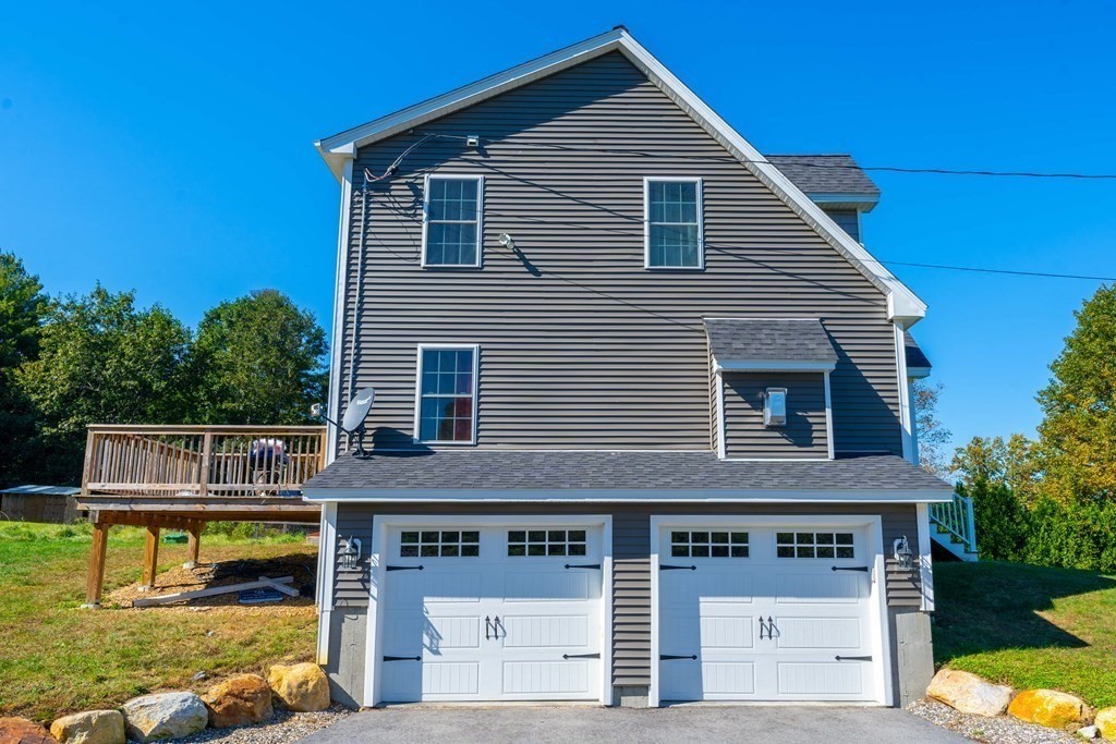 176 Oakham Road Barre, MA 01005 - Photo 10 of 36 a front view of a house with a yard