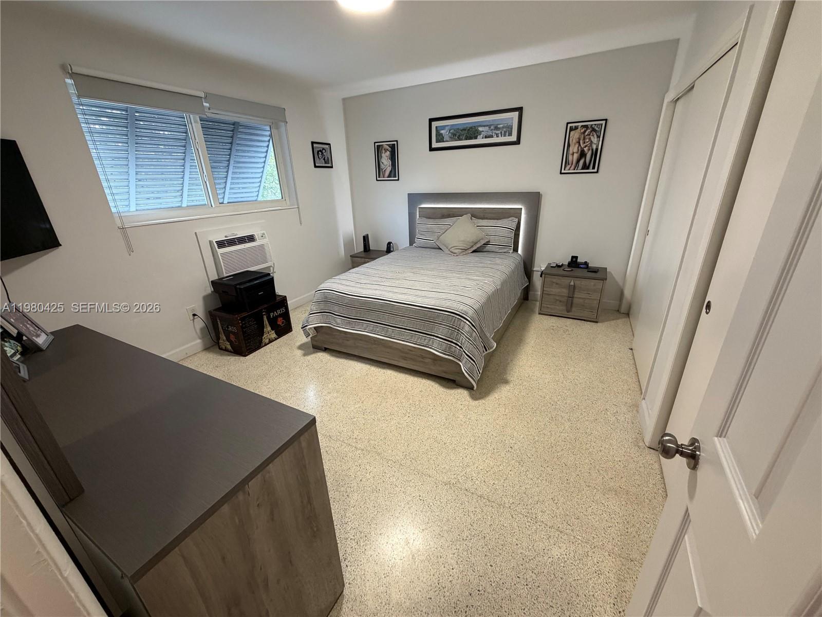 3055 Southwest 1st Avenue, Unit 201 Miami, FL 33129 - Photo 6 of 9 a bedroom with a bed and a dresser