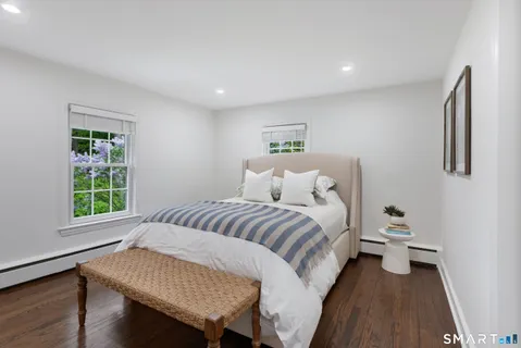 a bed room with a bed and a window