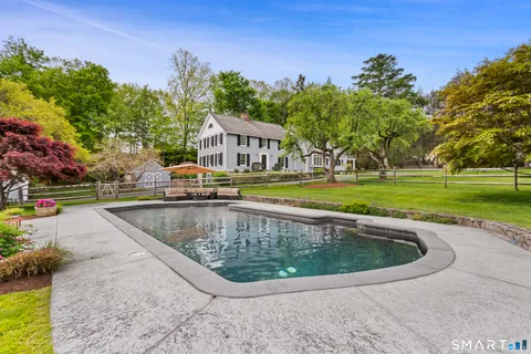 a view of a swimming pool with a garden