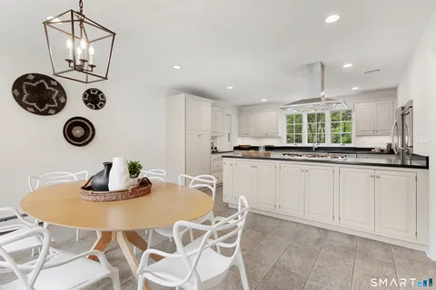 a kitchen with kitchen island appliances cabinets and counter space