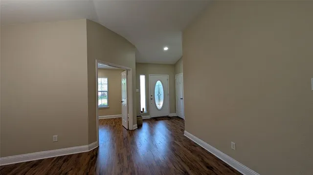 a view of entryway with wooden floor