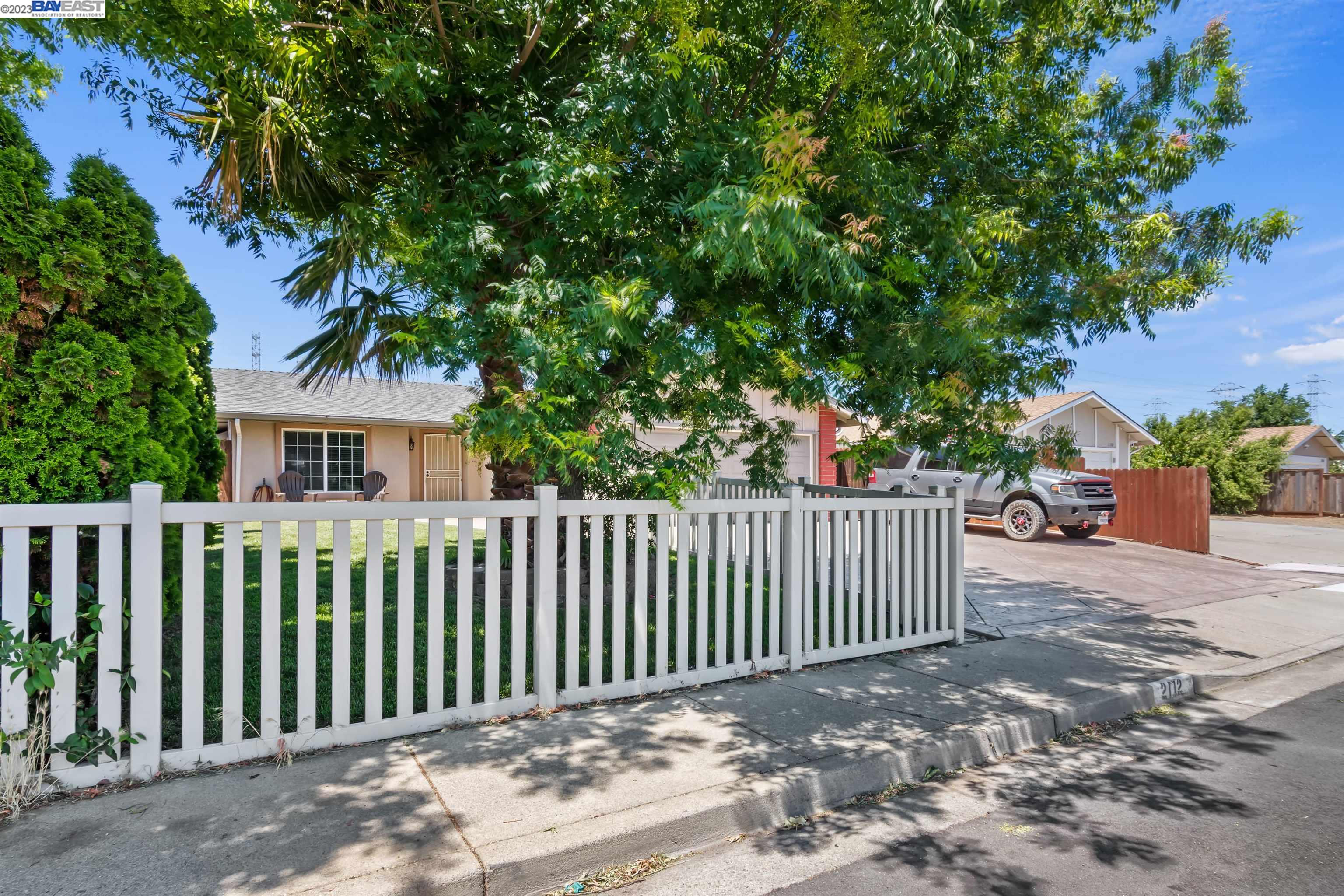 2112 Dover Way Pittsburg, CA 94565 - Photo 1 of 1 a view of a house with a small yard and wooden fence