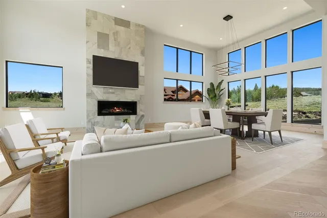 a large kitchen with kitchen island a sink a counter top space and stainless steel appliances