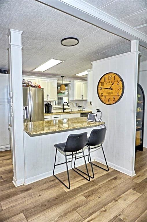 21052 Little Magens Loop Lutz, FL 33558 - Photo 12 of 46 a view of a kitchen with dining table and chair