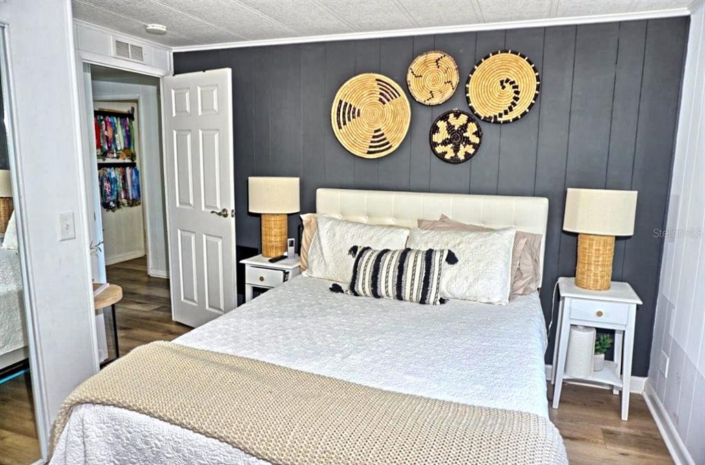 21052 Little Magens Loop Lutz, FL 33558 - Photo 28 of 46 a bedroom with a bed and painting on the wall