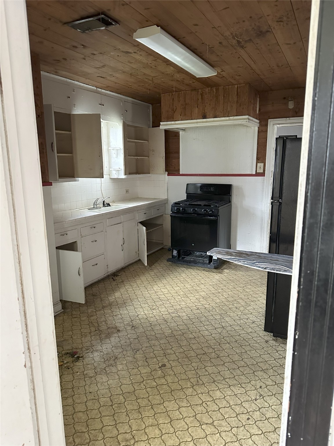 1108 MacArthur Street Rosenberg, TX 77471 - Photo 8 of 9 a bathroom with a sink and a mirror